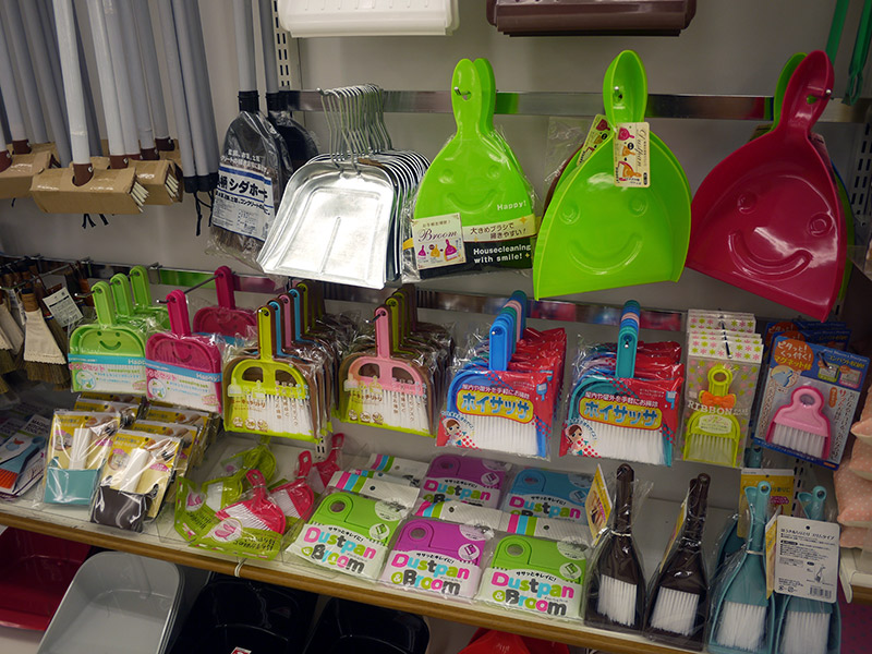 Dustpans and brooms in bright colors