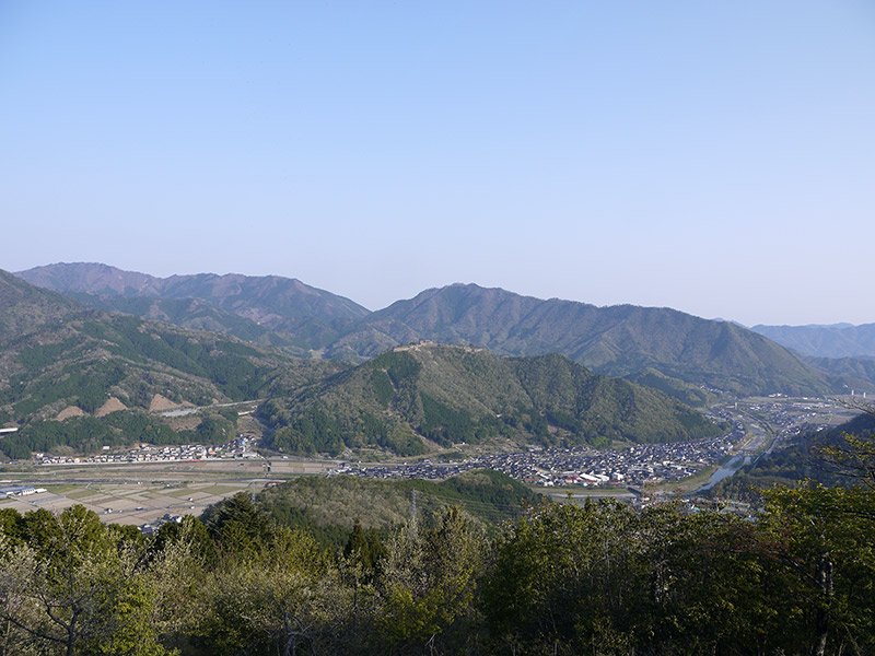 wide view of hills with town bellow in valley