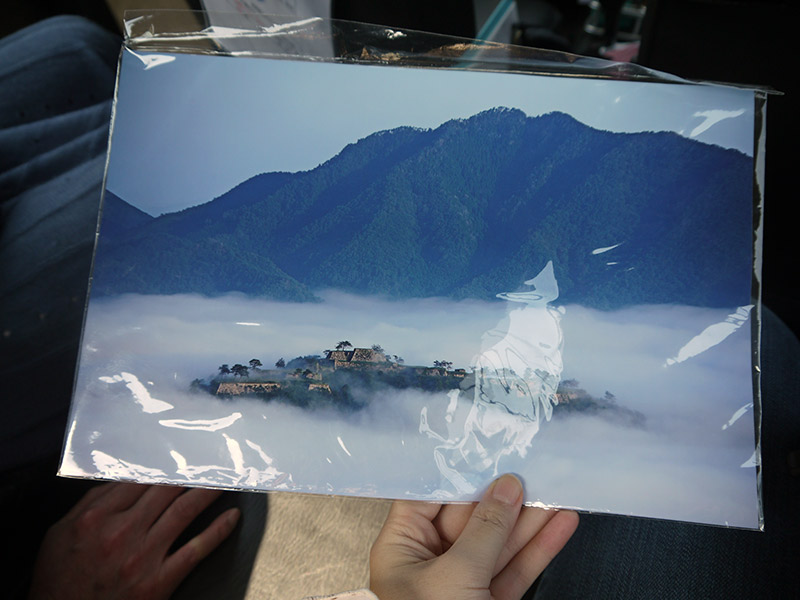 picture of takeda castle surrounded by clouds