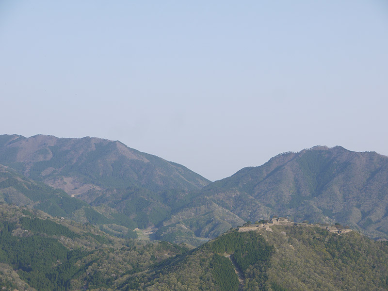 hill peaks with castle ruins