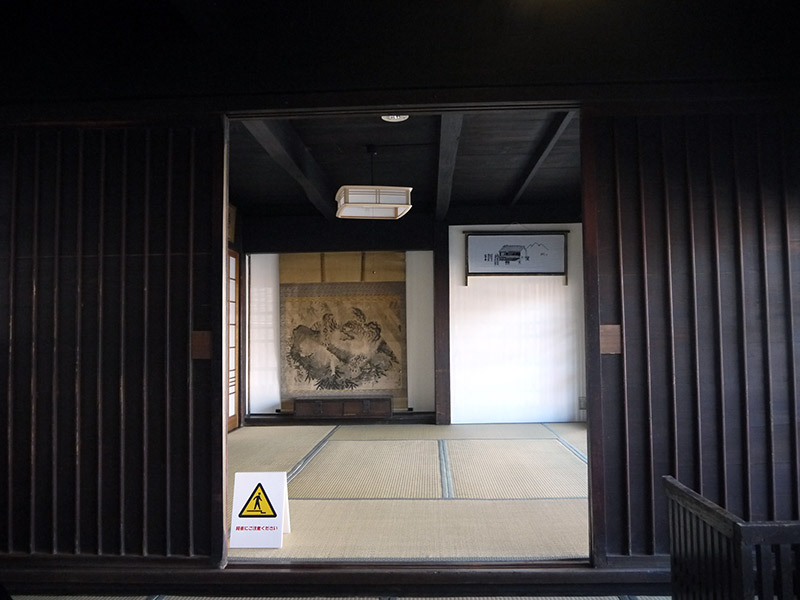 hallway looking into room with artwork