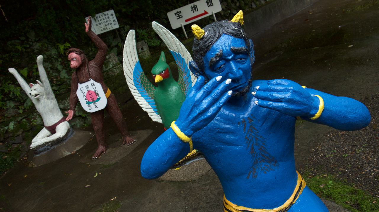 crying blue oni at momotaro park in inuyama