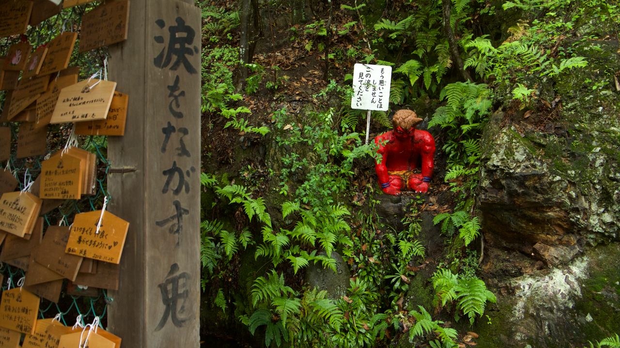 crying red oni at momotaro shrine