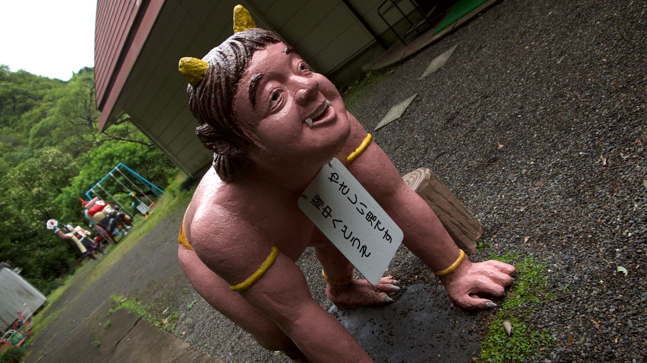 smiling oni statue