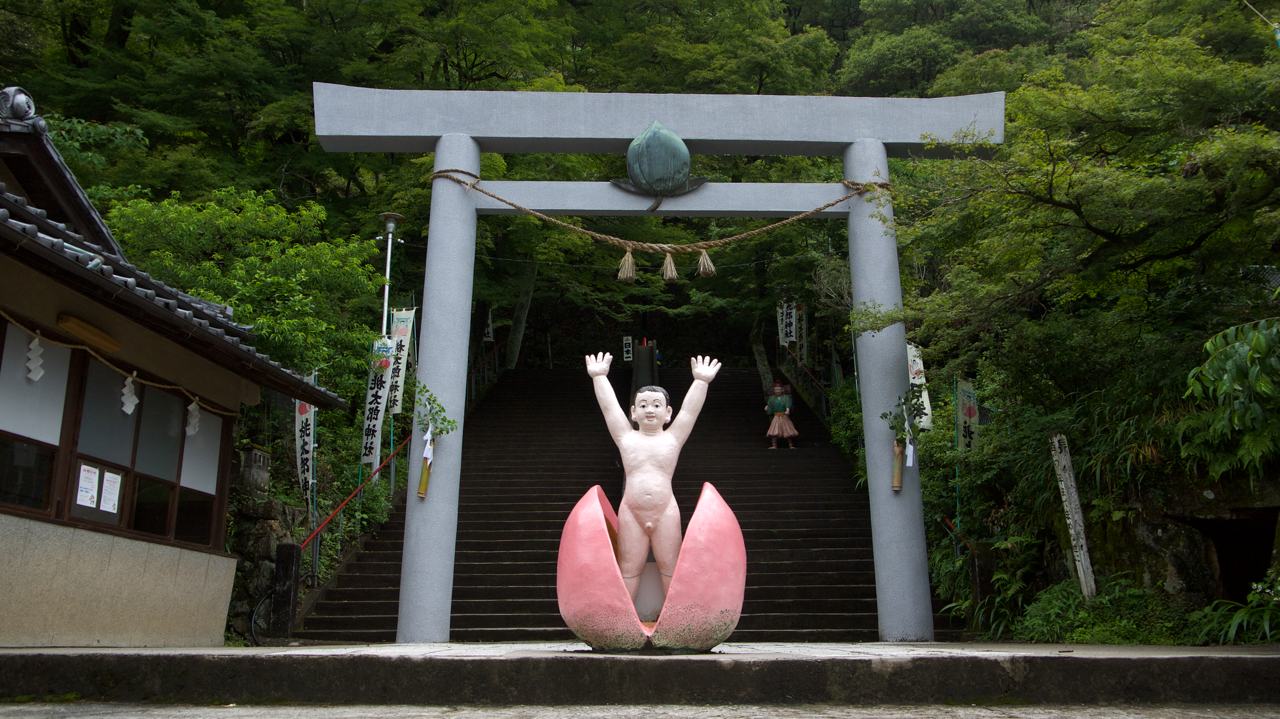 baby momotaro jumping out of a peach