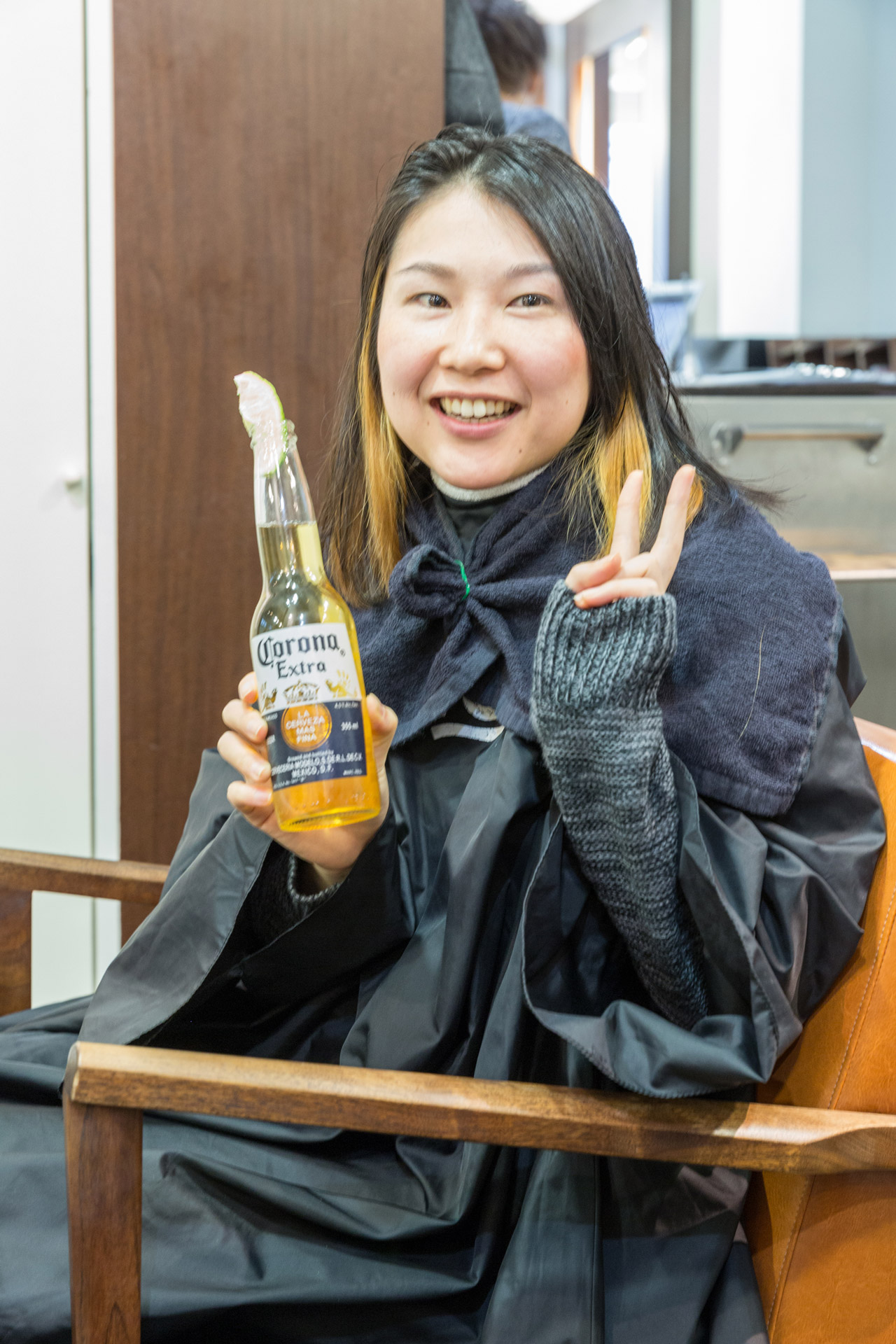 mami drinking a corona beer