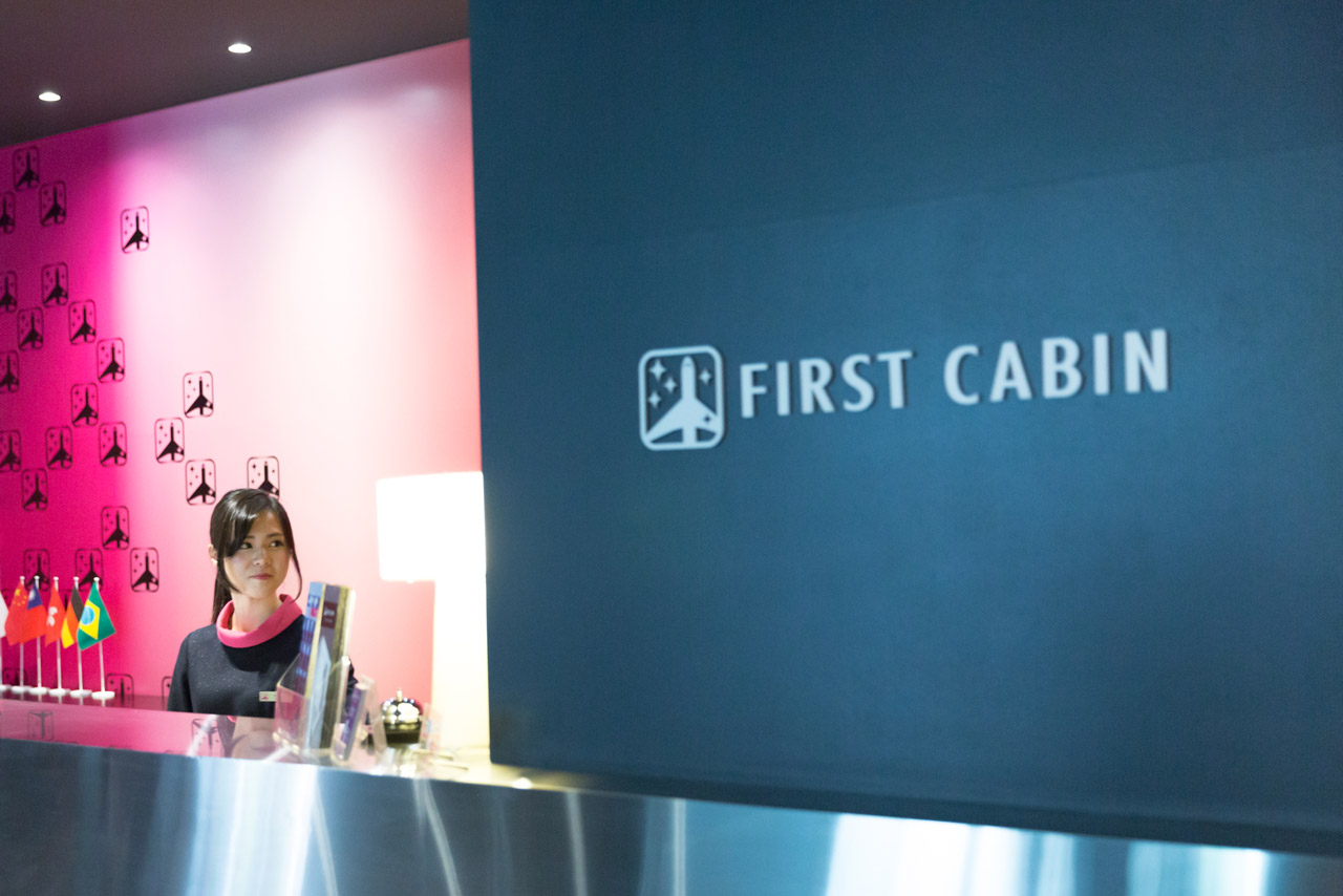 receptionist behind first cabin front desk