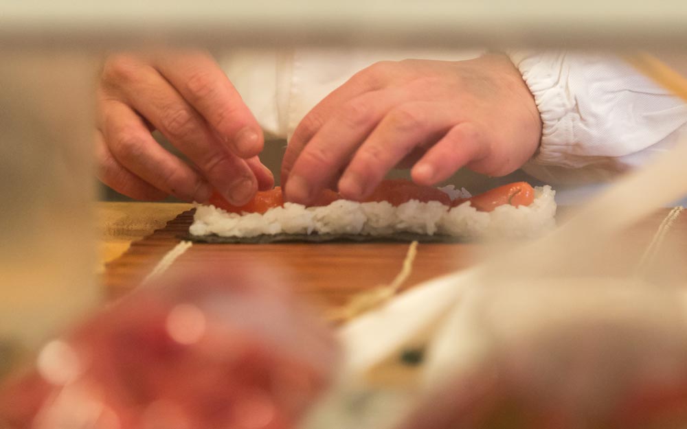 hands making sushi at sushiya no nohachi