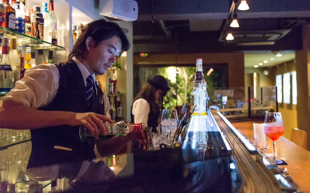 bartender at chouchou popon model train bar