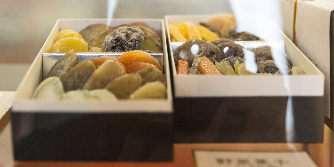 box set of candied vegetables behind glass