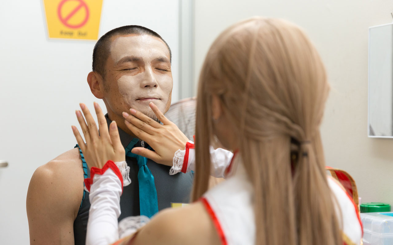man getting foundation makeup applied to face
