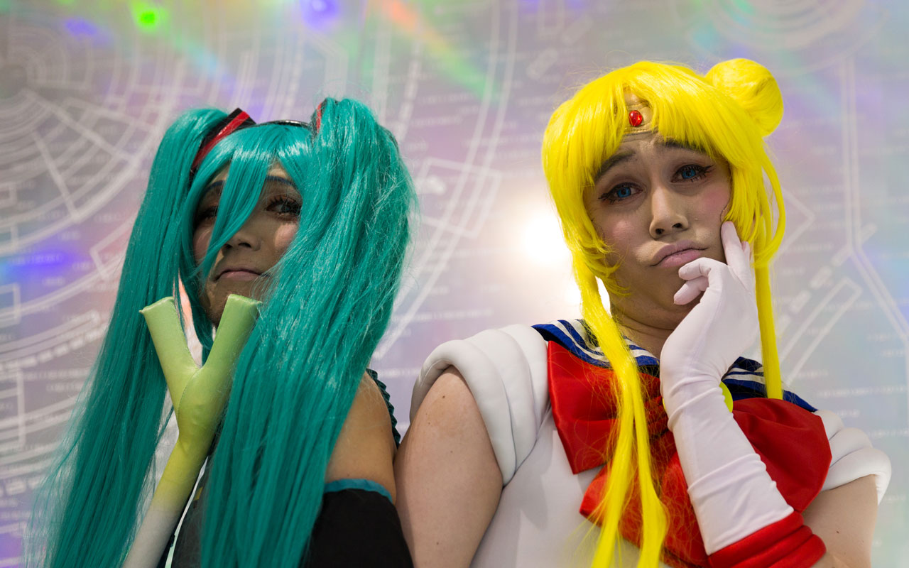 two men cosplaying as hatsune miku and sailor moon
