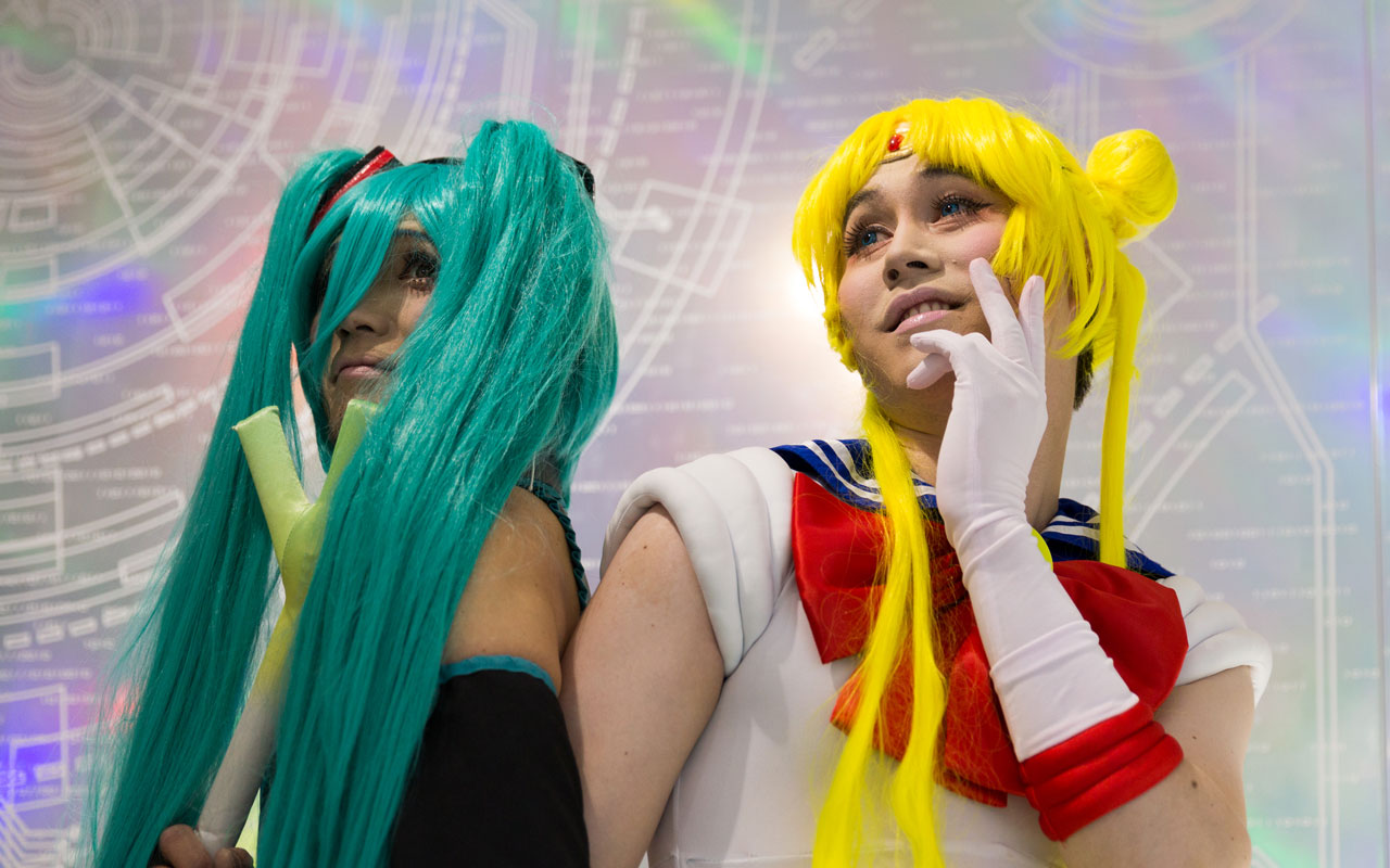 two men in hatsune miku and sailor moon cosplay