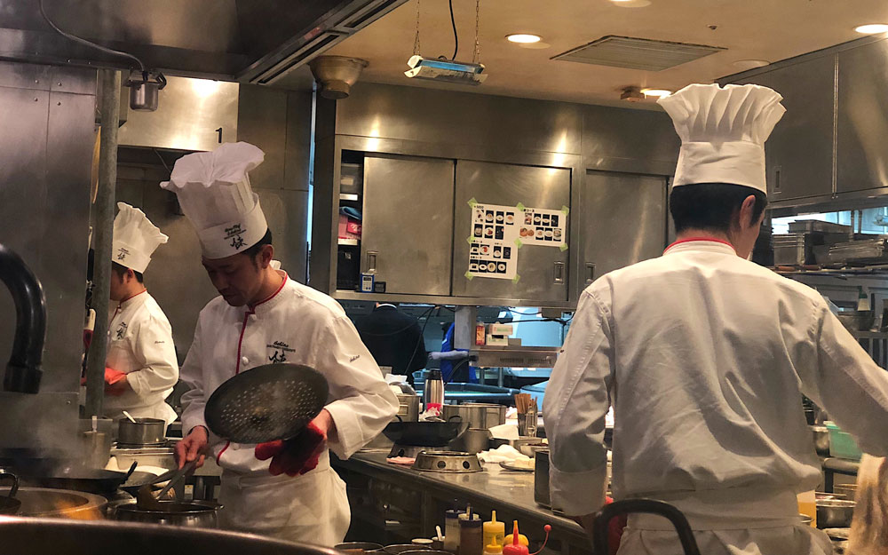 chefs working in kitchen at iron chef restaurant