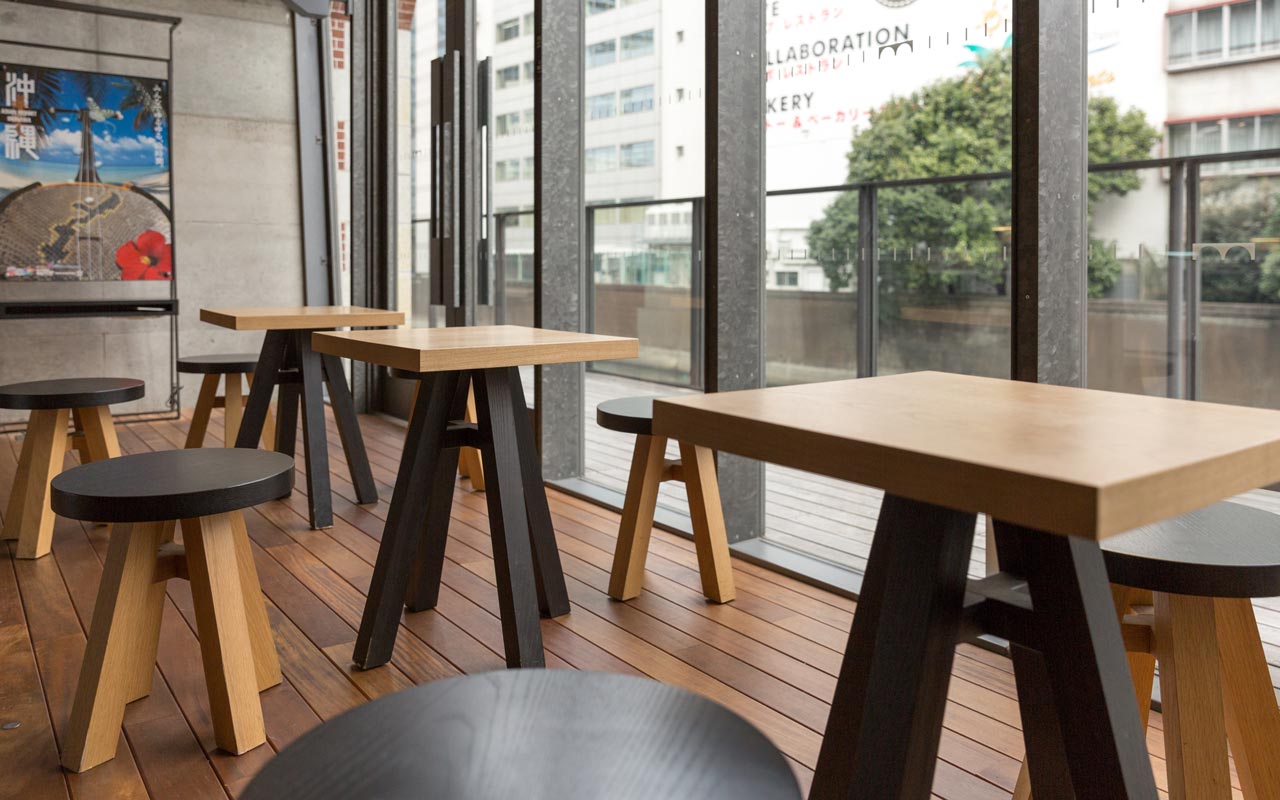 minimalist table and chairs at maach ecute