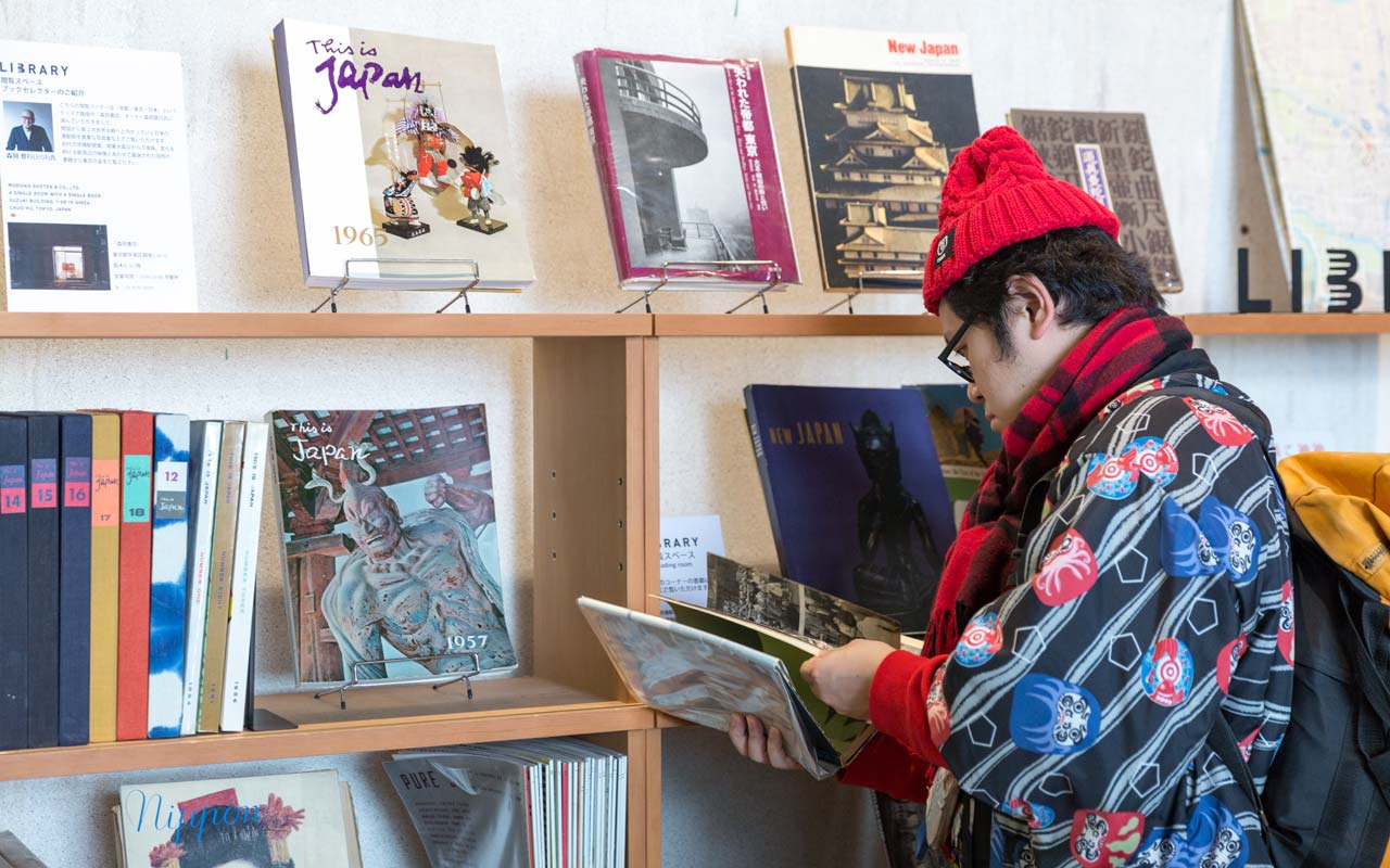 homeless kotani reading a book at maach ecute