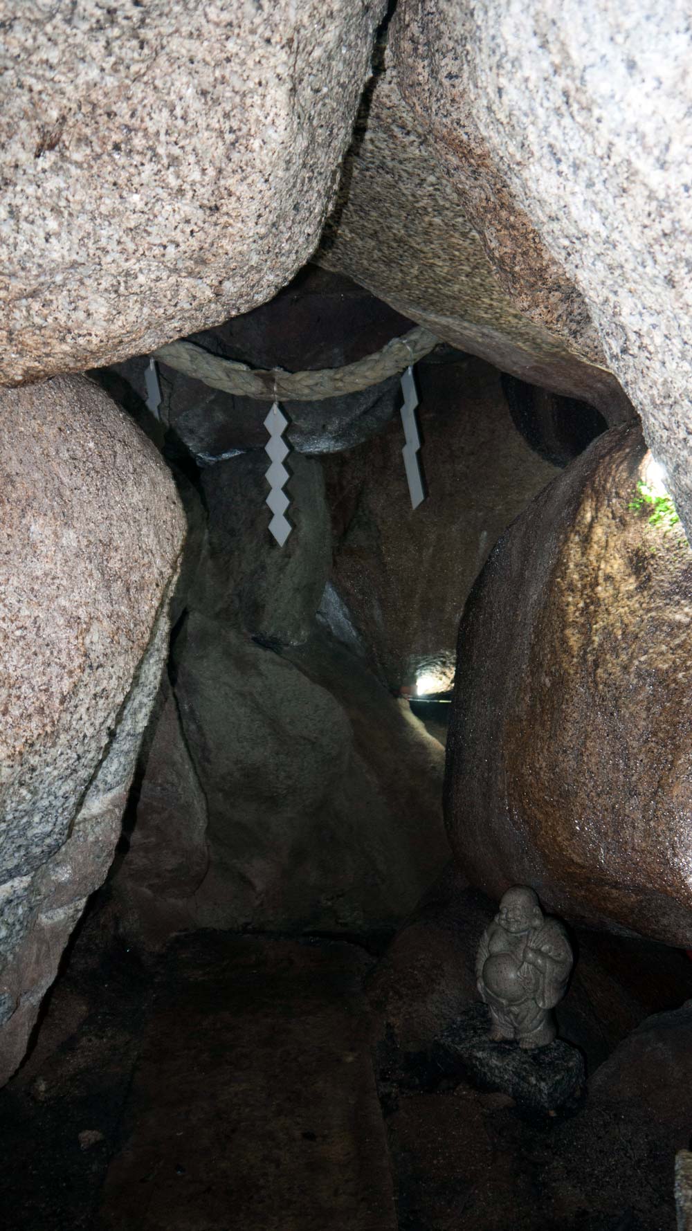 small statue in recess of cave